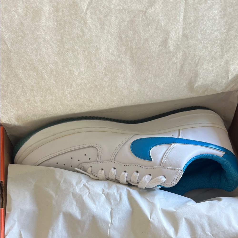 Nike women’s Air Force 1 White & Teal Low-Top Sneakers